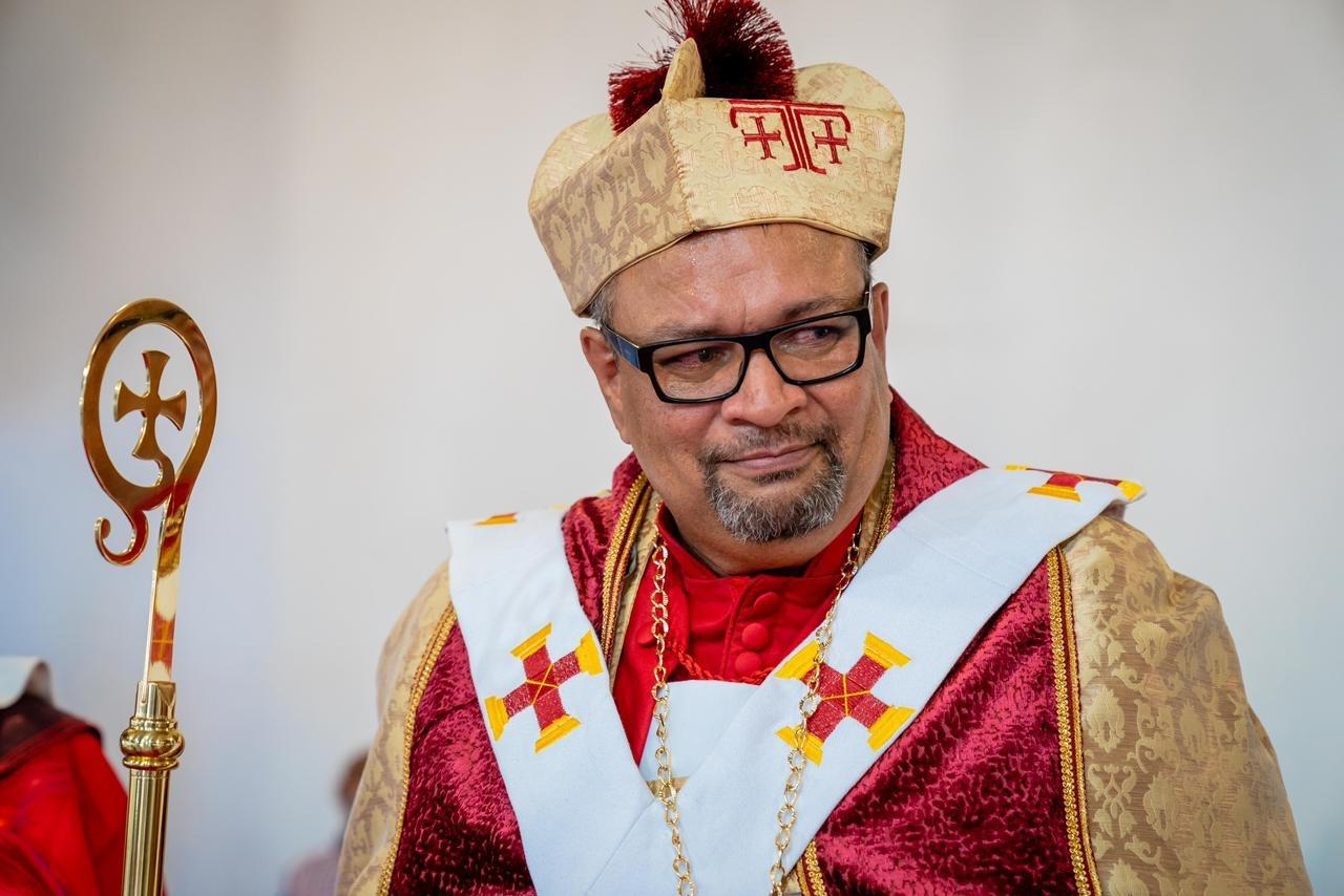 Archbishop Rennie Julius seated in vestments